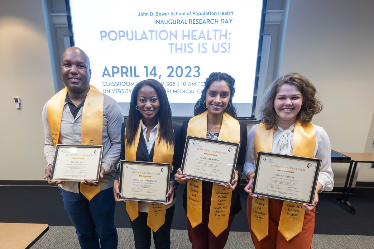 Four GTEC Honors Awardees with thier stoles and certificates at the 2023 SOPH Research Day